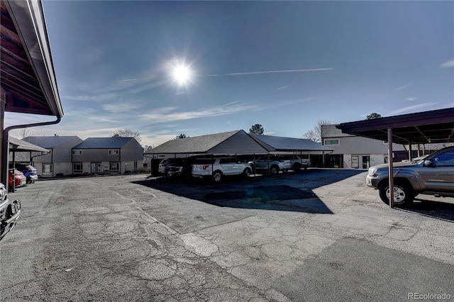 view of vehicle parking with a carport