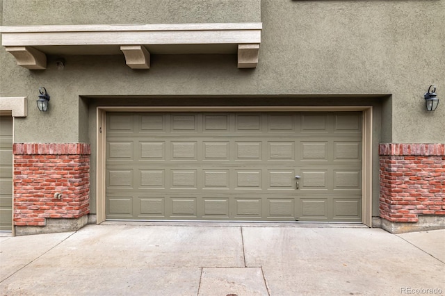 garage featuring concrete driveway