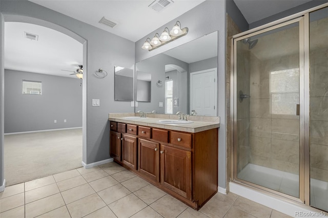 full bathroom featuring a ceiling fan, visible vents, and a sink
