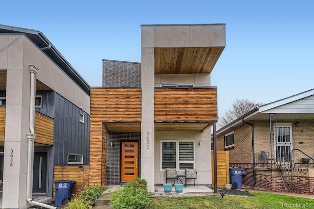 3632 N Pecos St, Denver, CO 80211 - modern home with a porch and a balcony