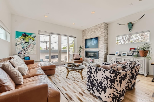 3632 N Pecos St, Denver, CO 80211 - living room featuring light wood-style flooring, plenty of natural light, a fireplace, and recessed lighting