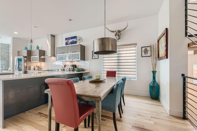 3632 N Pecos St, Denver, CO 80211 - dining area with light wood-type flooring, baseboards, and recessed lighting