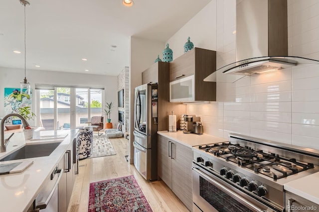 3632 N Pecos St, Denver, CO 80211 - kitchen with island exhaust hood, appliances with stainless steel finishes, modern cabinets, a sink, and recessed lighting