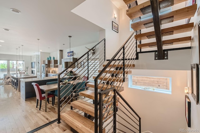 3632 N Pecos St, Denver, CO 80211 - staircase featuring wood finished floors and recessed lighting