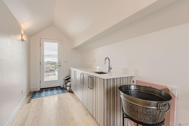 3632 N Pecos St, Denver, CO 80211 - washroom with a sink, light wood-style flooring, and baseboards
