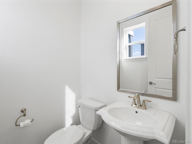 bathroom with a sink and toilet