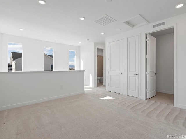 empty room featuring recessed lighting, baseboards, visible vents, and carpet flooring