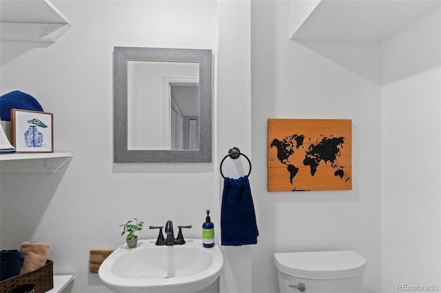 bathroom featuring a sink and toilet