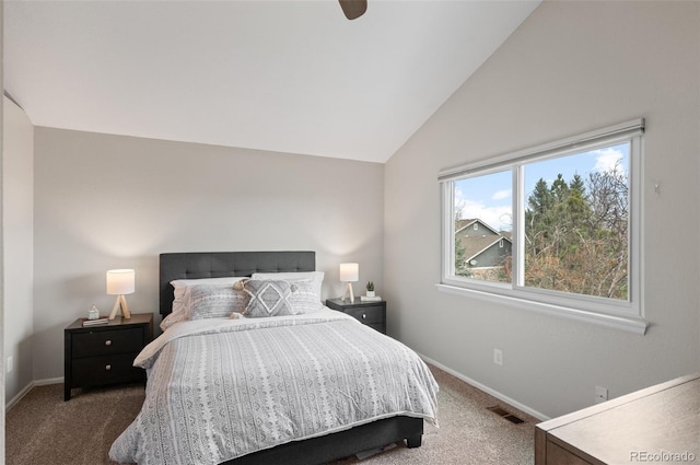 carpeted bedroom with visible vents, baseboards, and vaulted ceiling