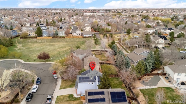 birds eye view of property with a residential view