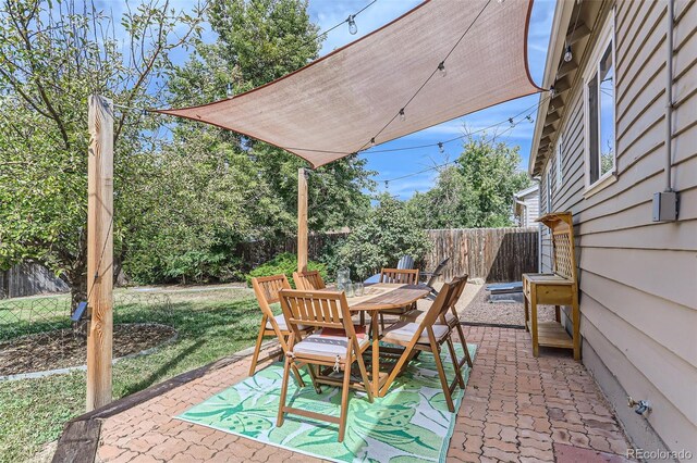 1171 Syracuse St, Denver, CO 80220 - view of patio / terrace featuring a fenced backyard and outdoor dining area