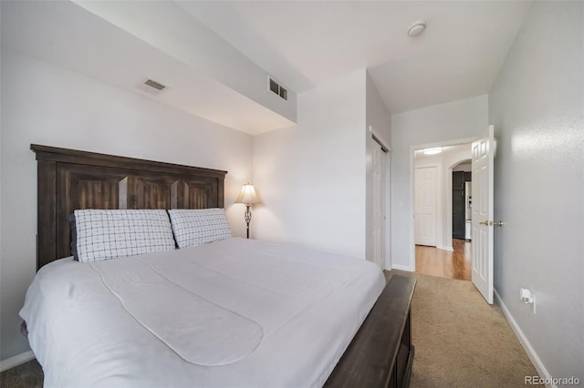 bedroom with a closet and carpet