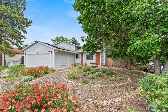 4194 S Kalispell St, Aurora, CO 80013 - ranch-style home featuring a garage