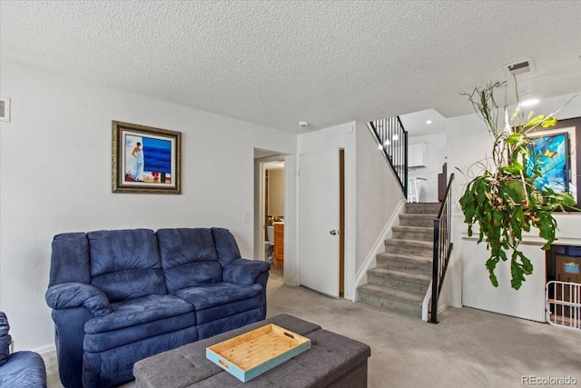 4194 S Kalispell St, Aurora, CO 80013 - carpeted living area featuring a textured ceiling and stairway