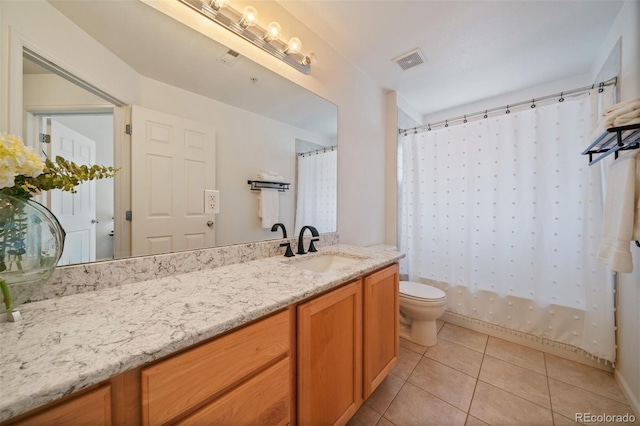 5465 Zephyr St Unit 201, Arvada, CO 80002 - bathroom featuring tile patterned flooring and vanity