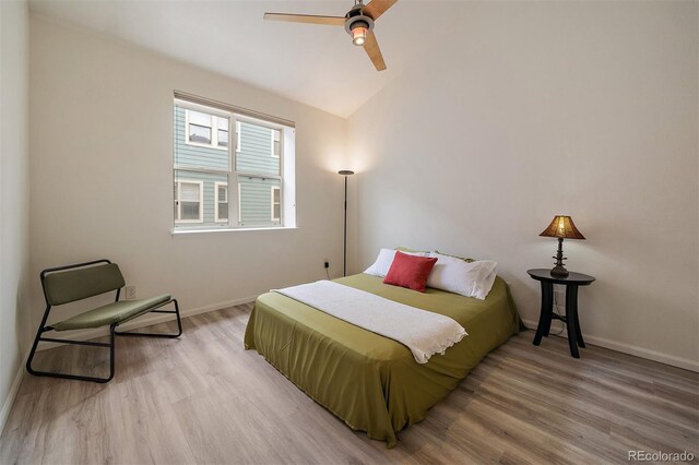 5465 Zephyr St Unit 201, Arvada, CO 80002 - bedroom with wood finished floors, vaulted ceiling, and ceiling fan