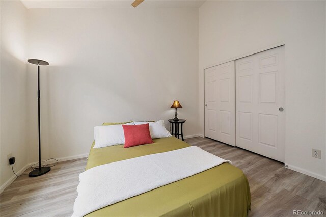 5465 Zephyr St Unit 201, Arvada, CO 80002 - bedroom featuring light wood-style flooring and a closet