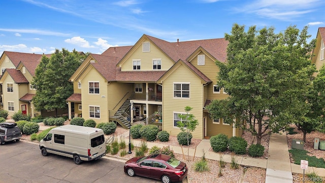 5465 Zephyr St Unit 201, Arvada, CO 80002 - multi unit property featuring stairs and a shingled roof