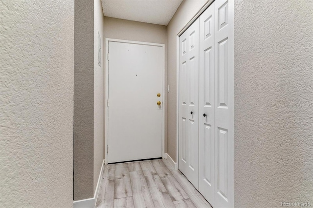 doorway featuring light hardwood / wood-style flooring