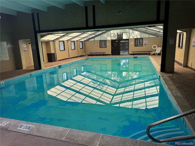 view of swimming pool with a patio