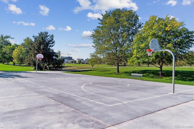 view of sport court featuring a yard