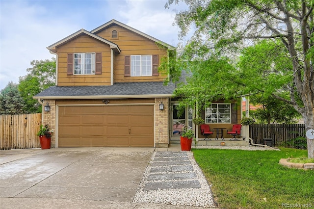 9559 Elizabeth Ct, Thornton, CO 80229 - view of front facade with an attached garage, concrete driveway, brick siding, and a shingled roof