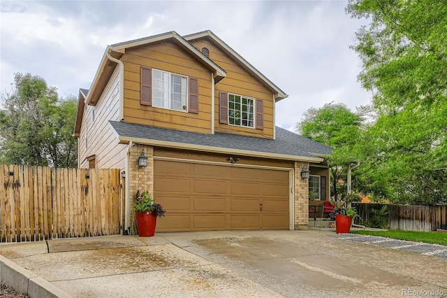 9559 Elizabeth Ct, Thornton, CO 80229 - view of front facade with concrete driveway, a garage, and roof with shingles