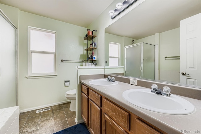 9559 Elizabeth Ct, Thornton, CO 80229 - bathroom with double vanity and an enclosed shower