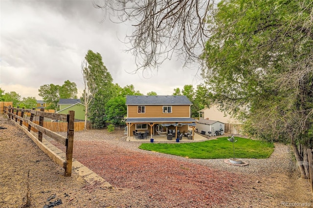 9559 Elizabeth Ct, Thornton, CO 80229 - rear view of property featuring a patio area and a fenced backyard