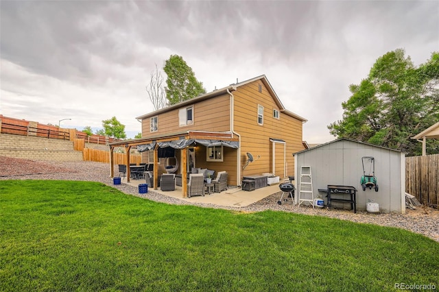 9559 Elizabeth Ct, Thornton, CO 80229 - rear view of house featuring an outdoor living space, a patio, a fenced backyard, and a storage unit