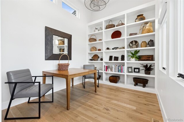 home office with light wood finished floors and baseboards