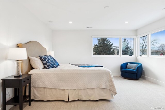 bedroom featuring multiple windows, recessed lighting, carpet flooring, and baseboards