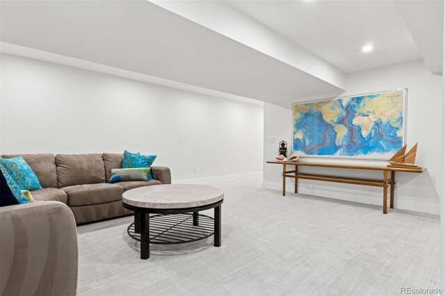 living area featuring baseboards, carpet flooring, and recessed lighting