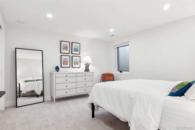 bedroom with light carpet, baseboards, and recessed lighting