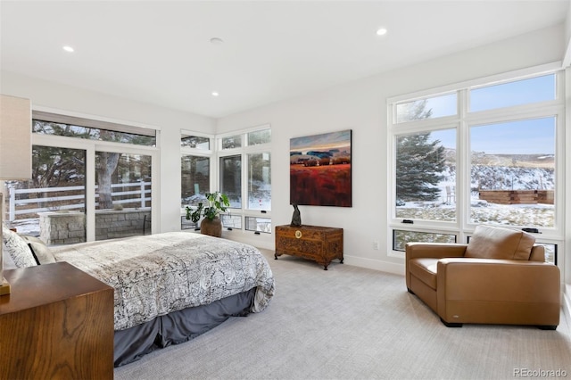 bedroom with recessed lighting, light colored carpet, and baseboards