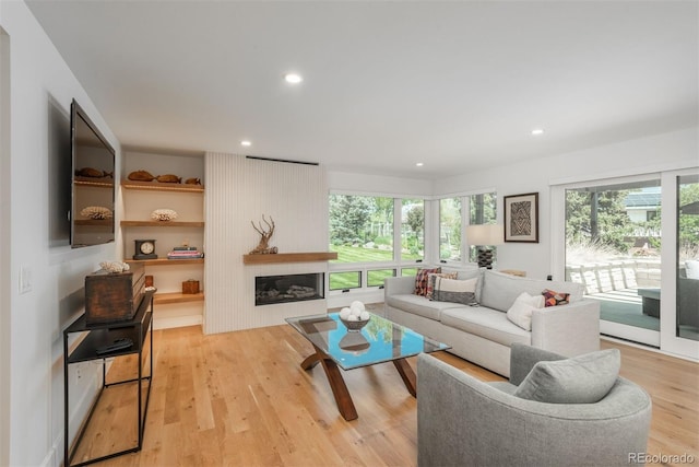 17326 W 57th Ave, Golden, CO 80403 - living area with plenty of natural light, light wood-type flooring, recessed lighting, and a fireplace