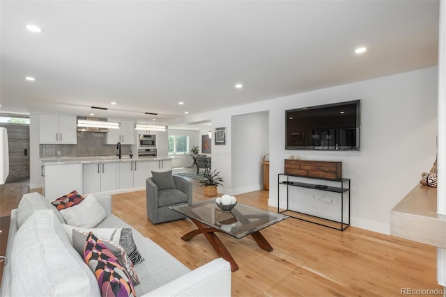 17326 W 57th Ave, Golden, CO 80403 - living area with light wood-style flooring, recessed lighting, and baseboards