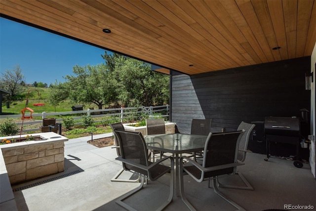 17326 W 57th Ave, Golden, CO 80403 - view of patio / terrace with outdoor dining space and fence