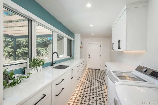 17326 W 57th Ave, Golden, CO 80403 - laundry room featuring washer and clothes dryer, cabinet space, light floors, healthy amount of natural light, and recessed lighting