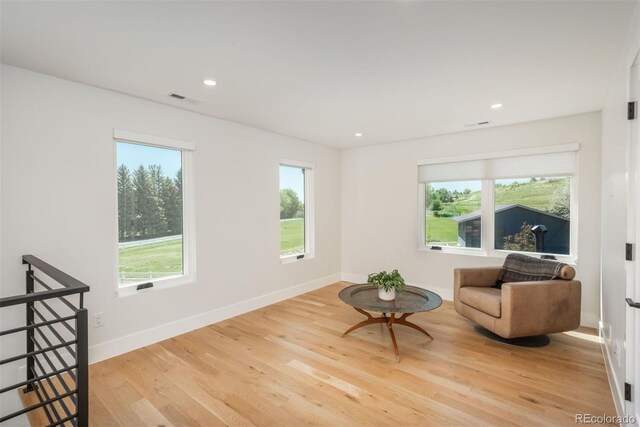 17326 W 57th Ave, Golden, CO 80403 - living area with an upstairs landing, wood finished floors, recessed lighting, and baseboards
