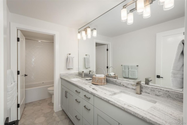 17326 W 57th Ave, Golden, CO 80403 - bathroom with toilet, double vanity, and shower / bath combination