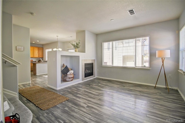 living room with a fireplace and dark hardwood / wood-style floors