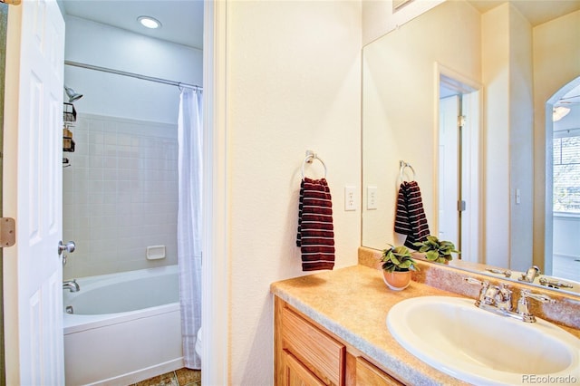 bathroom featuring shower / bath combination with curtain and vanity