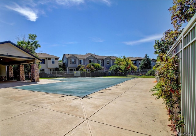 view of swimming pool with a patio