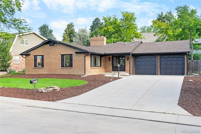 11010 W 29th Ave, Lakewood, CO 80215 - ranch-style home featuring brick siding, an attached garage, driveway, and a chimney