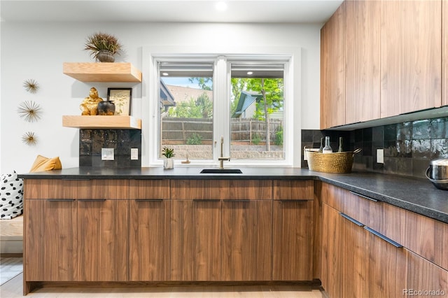 11010 W 29th Ave, Lakewood, CO 80215 - kitchen with tasteful backsplash, open shelves, modern cabinets, and brown cabinetry