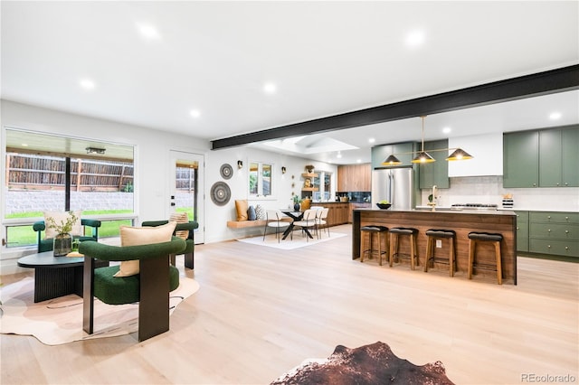 11010 W 29th Ave, Lakewood, CO 80215 - living area with recessed lighting, light wood-style flooring, and beamed ceiling