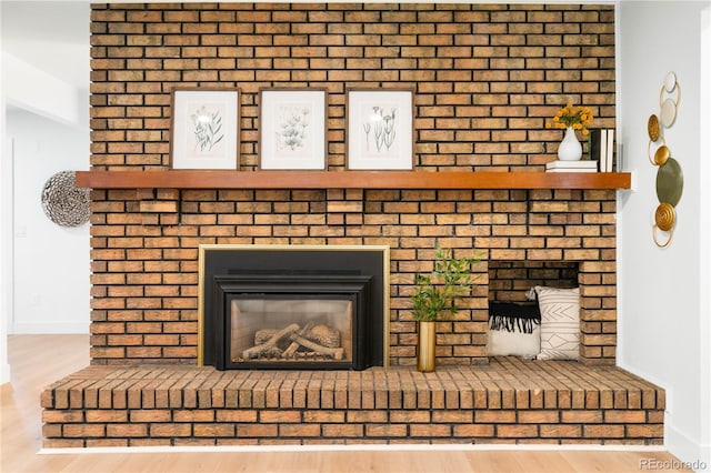 11010 W 29th Ave, Lakewood, CO 80215 - detailed view of a brick fireplace and wood finished floors