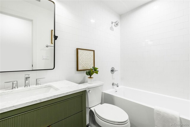 11010 W 29th Ave, Lakewood, CO 80215 - full bath featuring vanity, bathing tub / shower combination, and tile walls