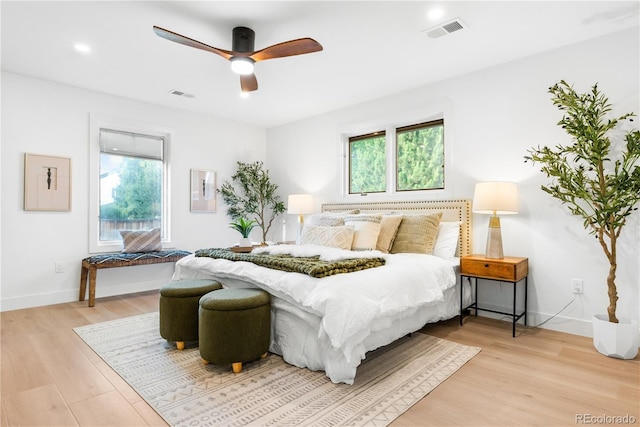 11010 W 29th Ave, Lakewood, CO 80215 - bedroom featuring light wood finished floors and ceiling fan